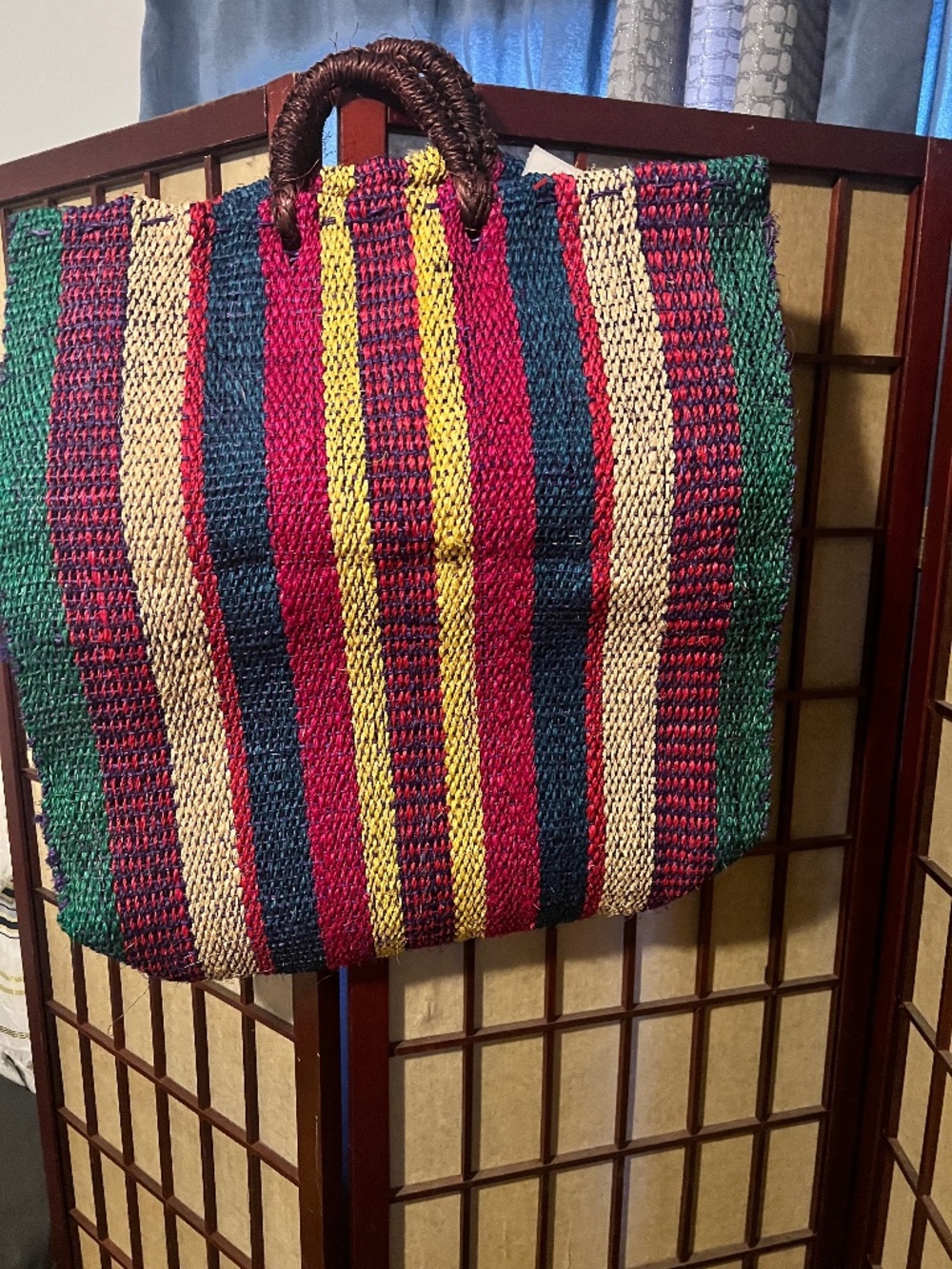 Beautiful handwoven artisan tote featuring vibrant multicolor stripes and sturdy